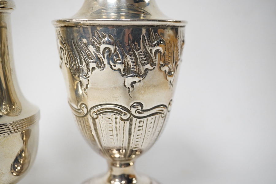 A late Victorian silver vase shaped sugar caster, Walker & Hall, Sheffield, 1895, 18.3cm, together with a later silver sugar caster by William Hutton & Sons, 10.1oz.
